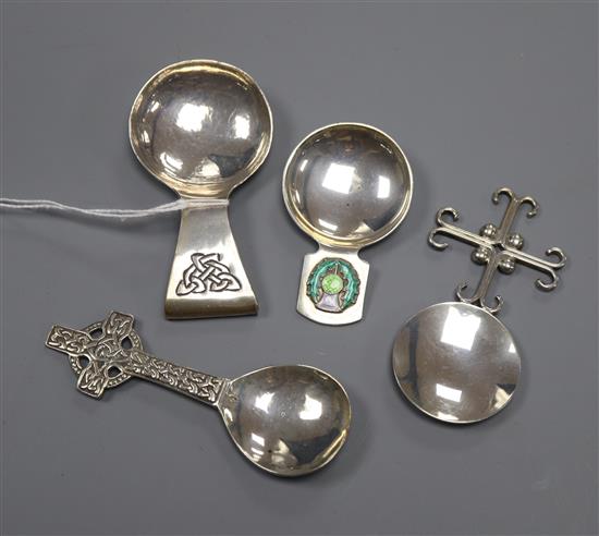 Four assorted silver caddy spoons including enamelled, two Scottish including Elizabeth Henry Kirkwood and one Irish.